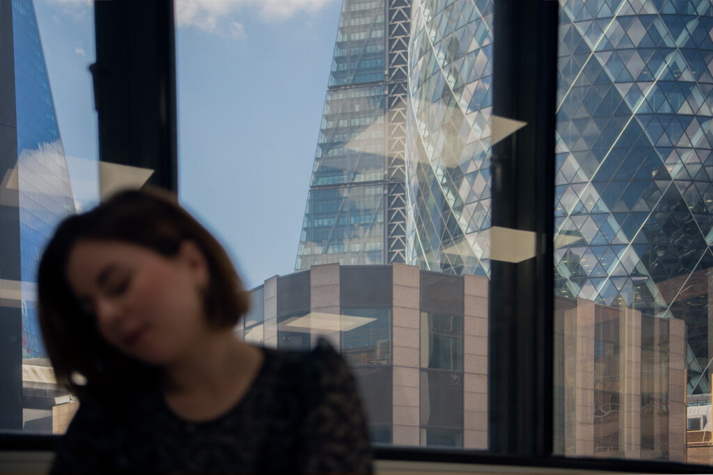 UKCBC student studying with the famous gherkin skyscraper in the background